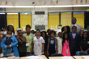 Attorney Gillette in a group picture with elementary students
